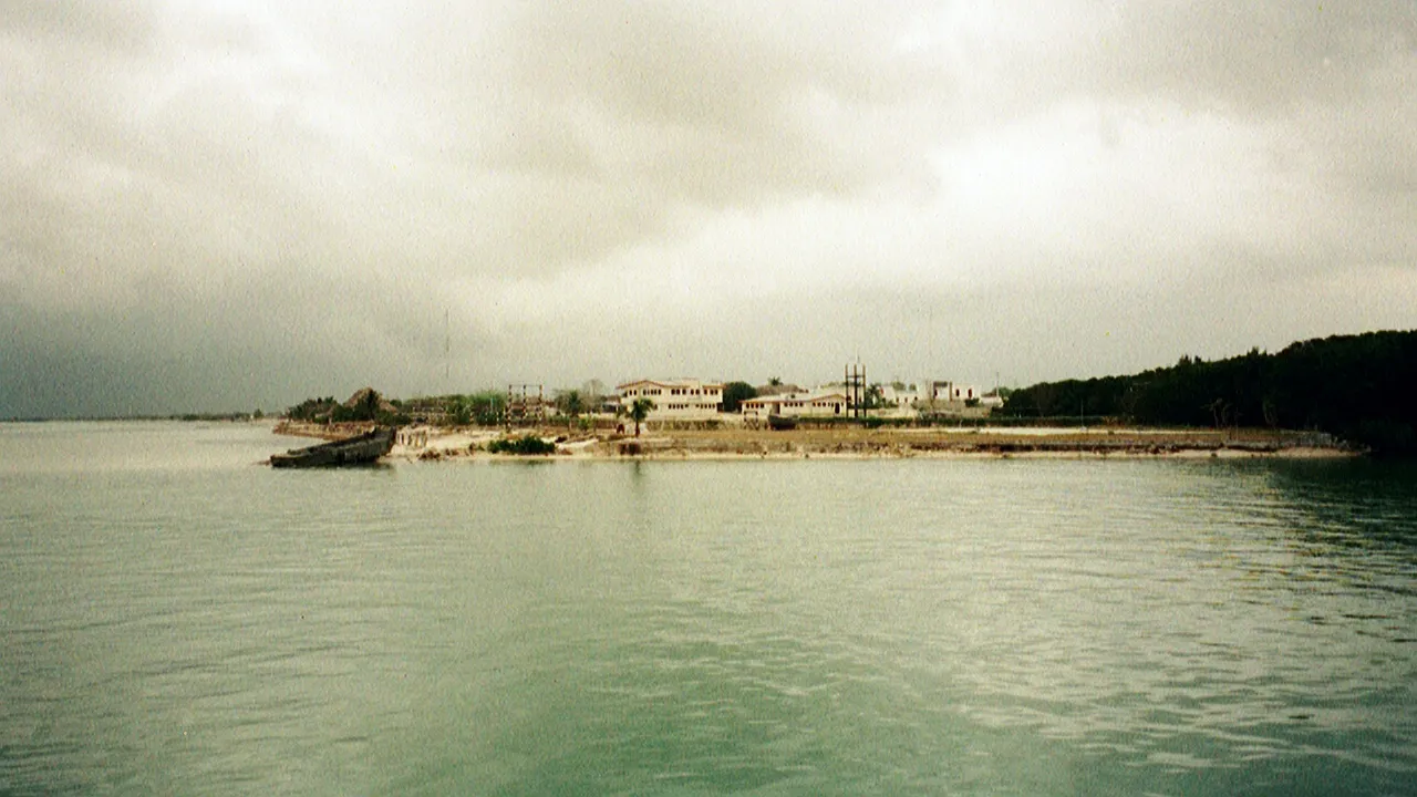 A seaside village. Beyond the white buildings is a Mexican Army secret base.